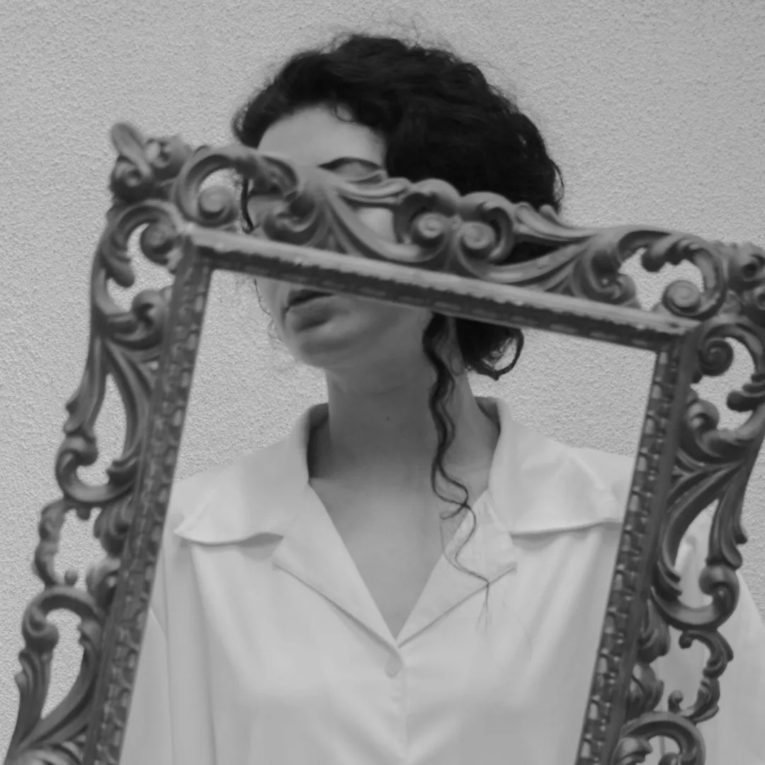 women's face concealed by a frame